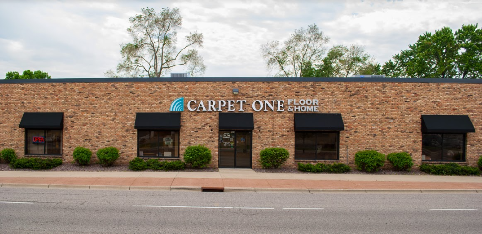 beige carpet with couch and chair in living room